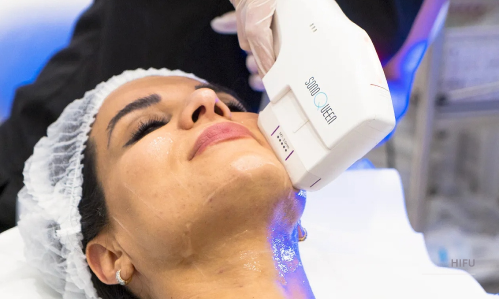 Woman receiving a non-invasive skin tightening treatment on the neck.
