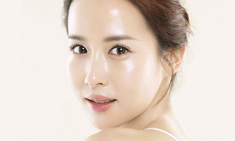 Woman with smooth, clear, and glowing skin after effective skin treatment.